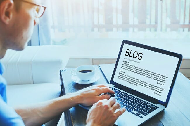 Real estate agent writing blog content at a desk